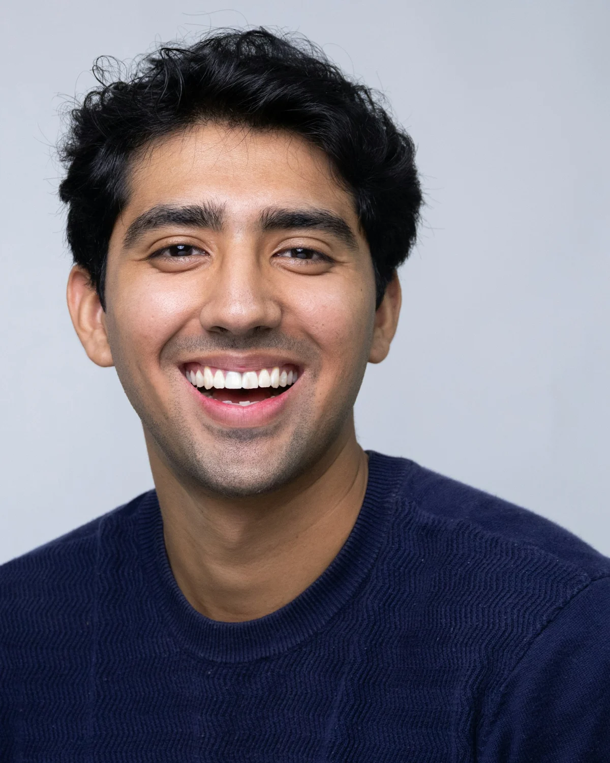 Audience portrait: man in a navy sweater